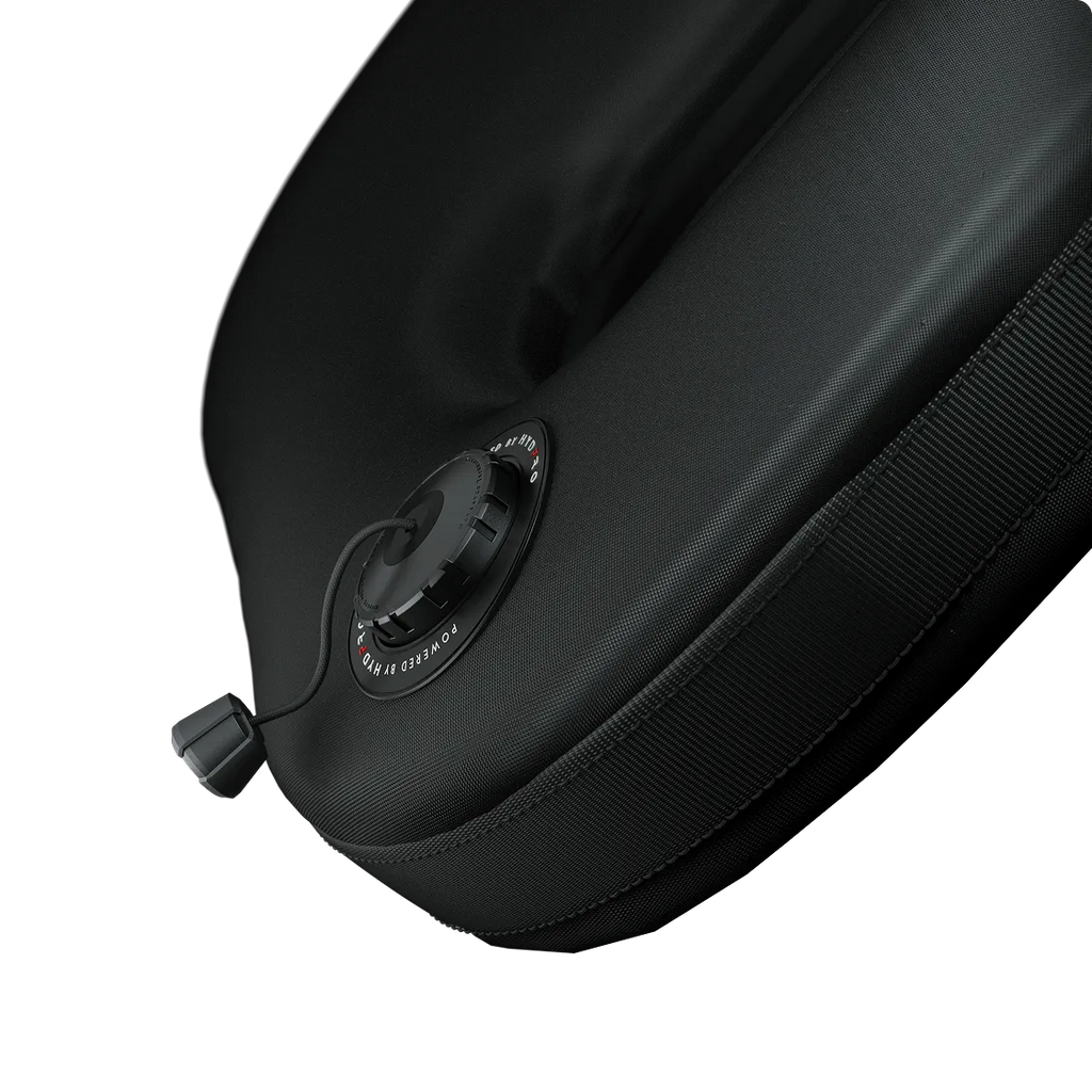 P04 Shield valve mounted on a padded fabric panel, three-quarter angle showing zip trim and dump toggle