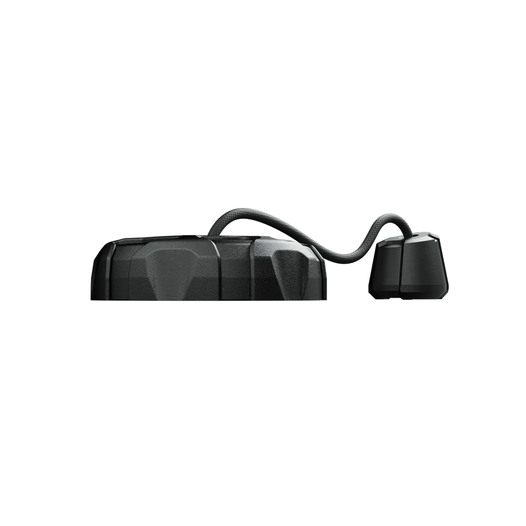 Black faceted lid connected by a coiled cable to a smaller fitting