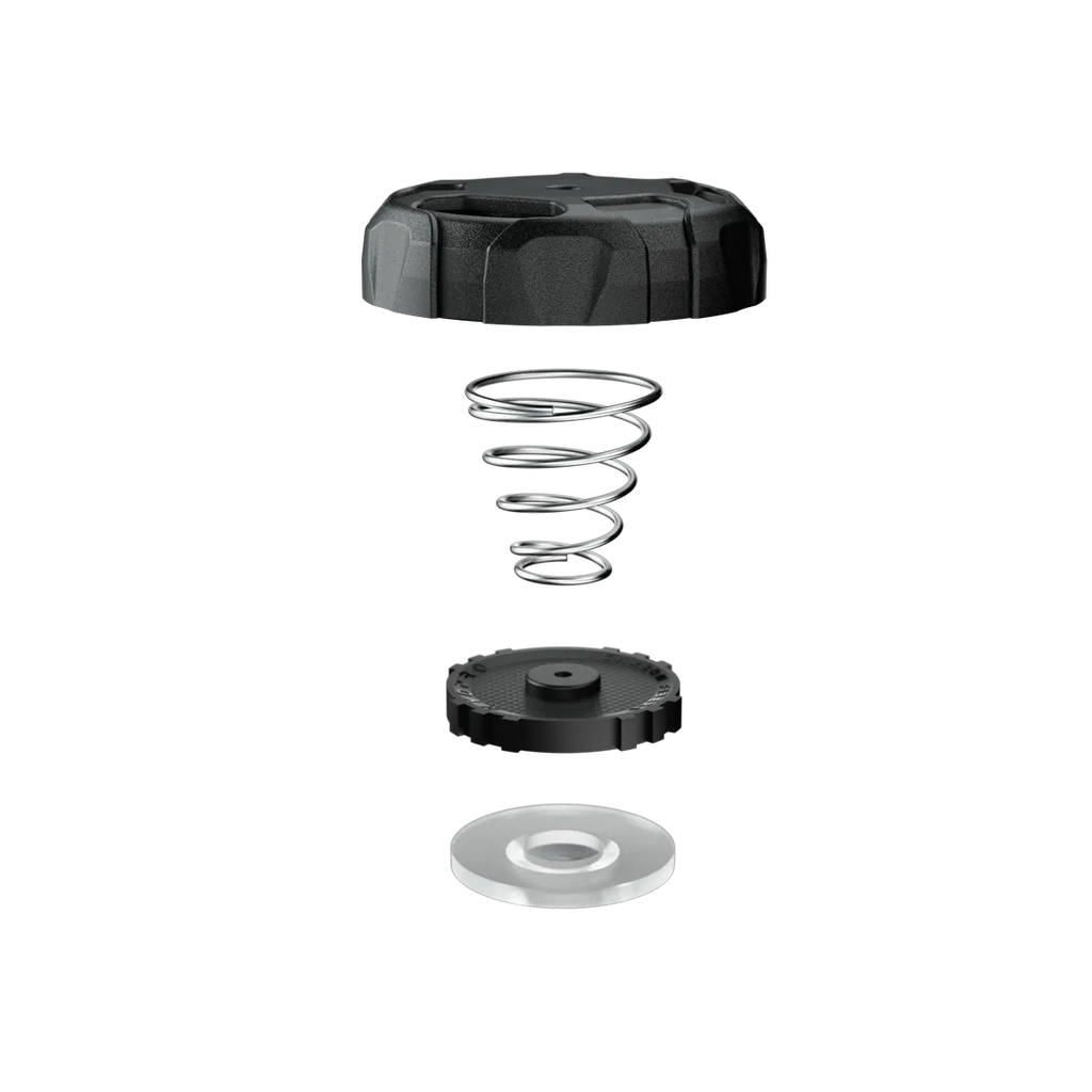 Exploded view of the OPV T01: lid, coil spring, piston disc and clear seal washer stacked apart