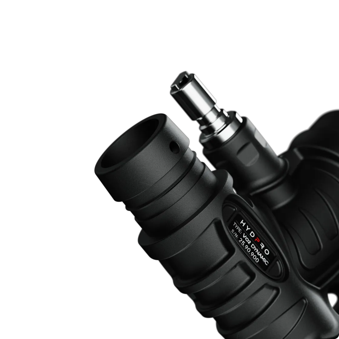 Macro close-up of the chrome low-pressure port and HYDPRO nameplate on the Dynamic